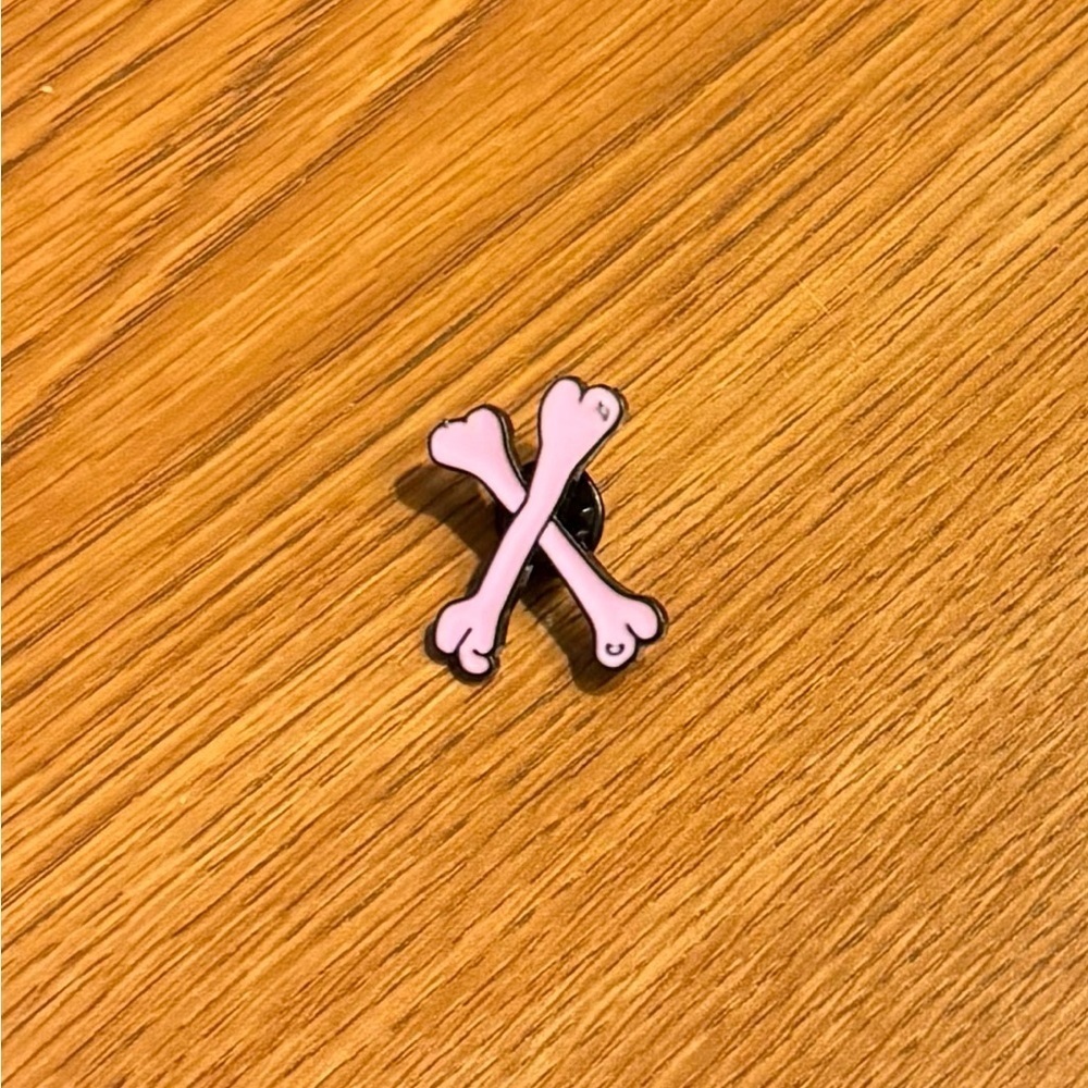 Women’s Accessories Cute Fun Pink Crossed Bones Enamel Pin with Black Accents